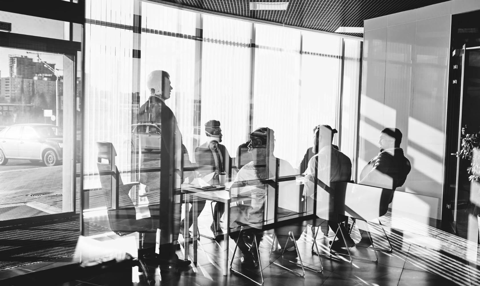 Professionals sitting at a table during meeting